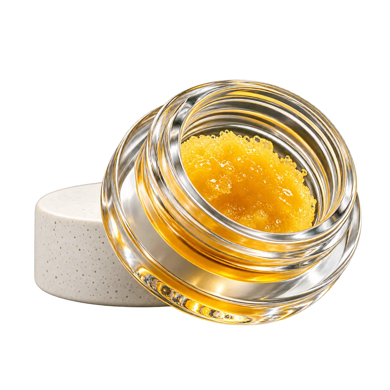 Glass jar of golden cannabis concentrate