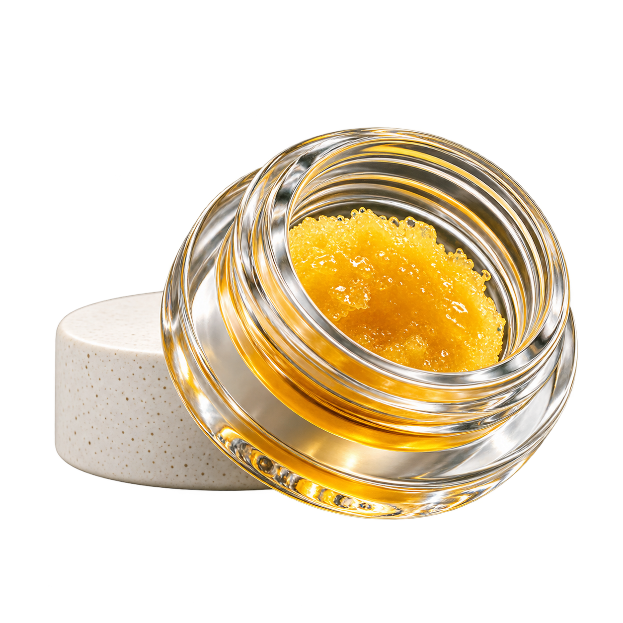 Glass jar of golden cannabis concentrate